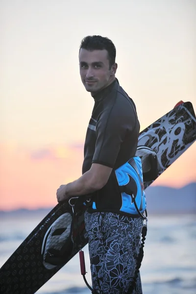Portrait of a young kitsurf man at beach on sunset — Stock Photo, Image