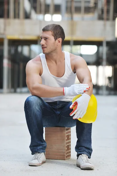 Hard worker on construction site Stock Photo