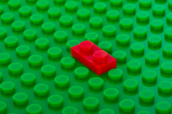 Plastic construction with red brick — Stock Photo, Image