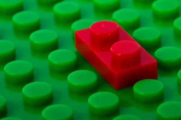 Construção de plástico com tijolo vermelho — Fotografia de Stock