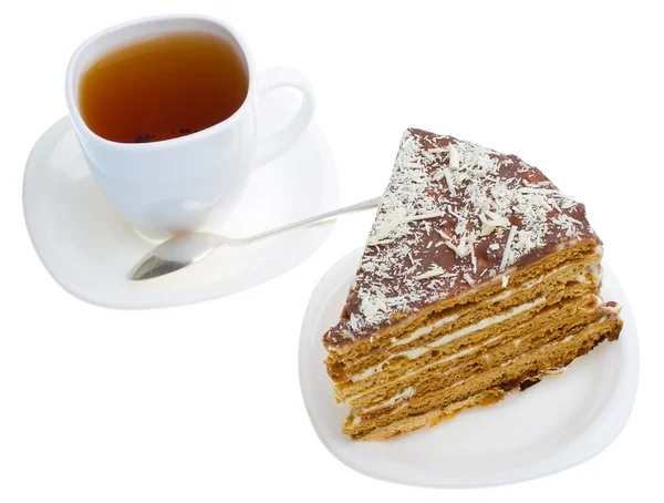 Pedaço de bolo de mel e xícara de chá — Fotografia de Stock
