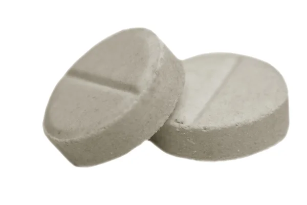 Kaksi valkoista pillereitä — kuvapankkivalokuva