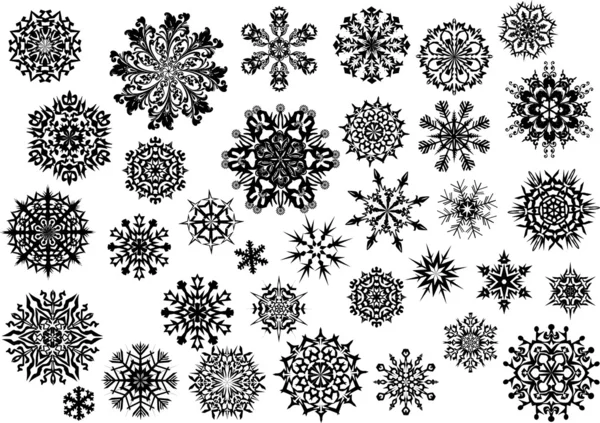 Treinta y cuatro copos de nieve negros — Archivo Imágenes Vectoriales