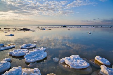 Sky reflection in winter sea clipart