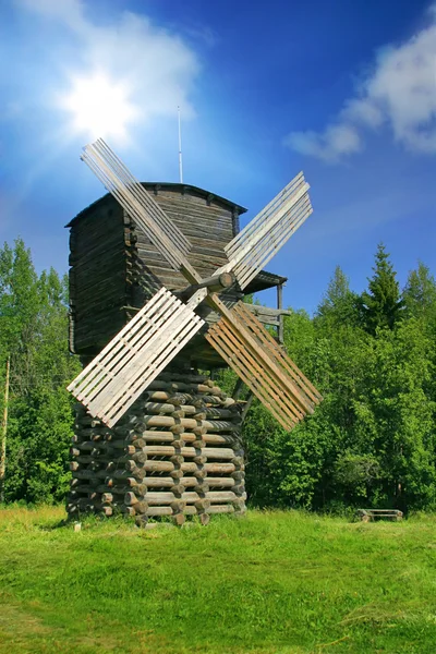 Windmill in forest under sun — Stock Photo, Image