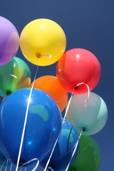 Colorful balloons in a clear blue sky — Stock Photo, Image