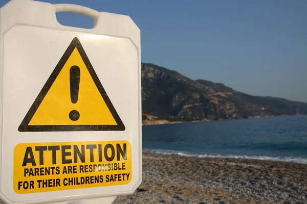 Warning on beach — Stock Photo, Image