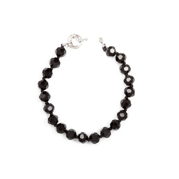 Schwarze Perlen auf weiß — Stockfoto