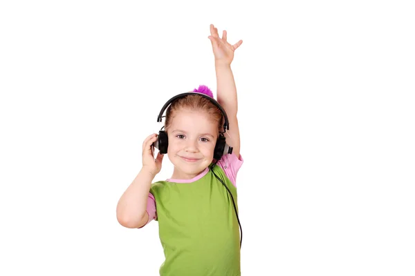 小女孩用耳机欣赏音乐中 — 图库照片