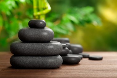 Spa stones on green background clipart