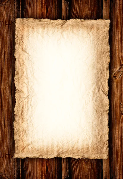 Tło - stare zmięty papier na drewnie — Zdjęcie stockowe