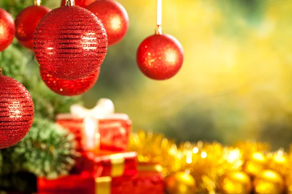 Christmas background - baubles, spruce tree and gifts — Φωτογραφία Αρχείου
