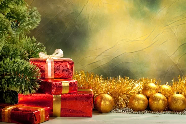 Christmas background - golden balls and gifts — Stock Photo, Image