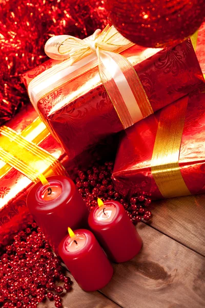 Gifts and candles - christmas decoration — Stock Photo, Image