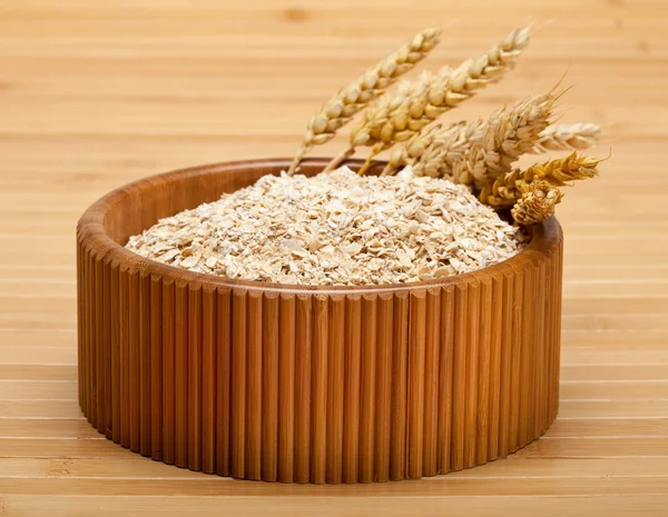 Bowl of oat flakes — Stock Photo, Image