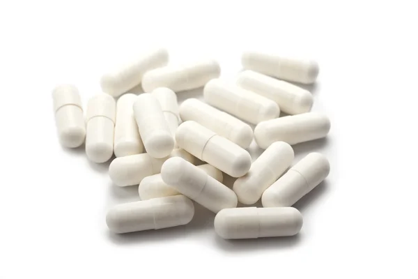 Comprimidos isolados em branco — Fotografia de Stock