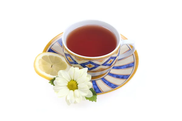Xícara de chá, limão e flor — Fotografia de Stock