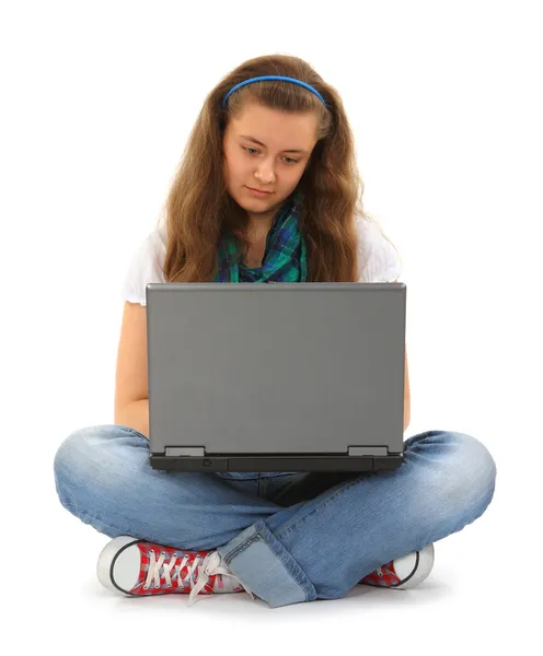 Tiener met laptop en headset — Stockfoto