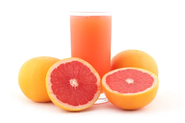 Grapefruitsap en rijpe grapefruits — Stockfoto
