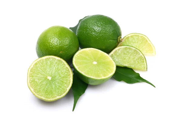 Green limes on white background — Stock Photo, Image
