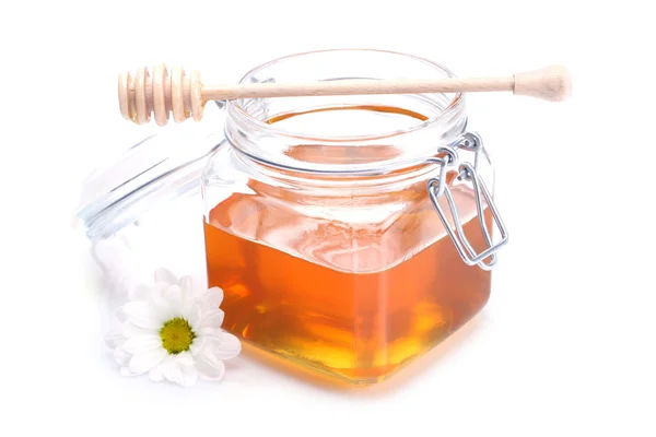 Jar of honey , dipper and flower — Stock Photo, Image