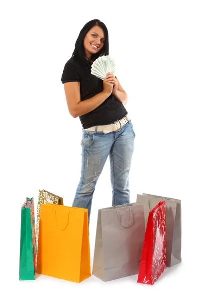 Shopping - Young woman with money and bags — Stock Photo, Image