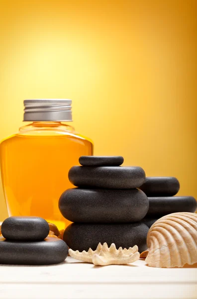 Spa minerals - essential oil and massage stones — Stock Photo, Image