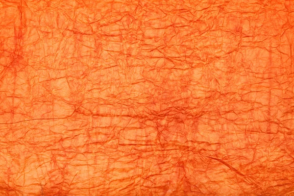 Оранжевый фон - смятая бумага — стоковое фото