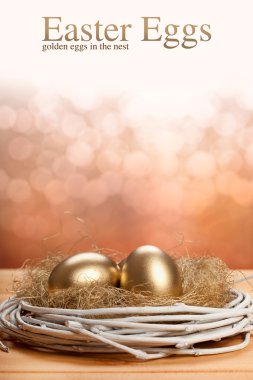 Easter eggs - Golden eggs in the nest clipart