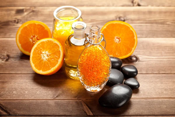 Orange bath salt, essential oil and ripe fruits — Stock Photo, Image