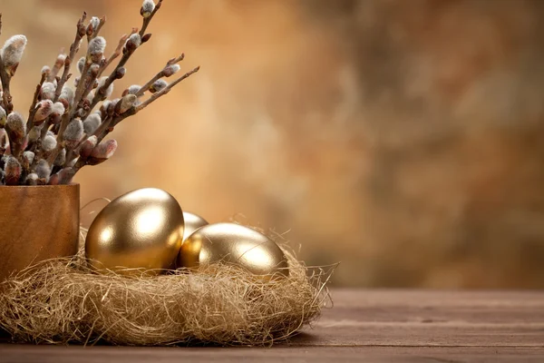 Easter - Golden eggs in the nest Stock Photo