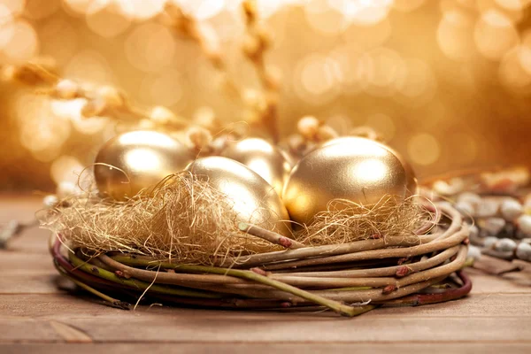 Golden nest eggs Stock Photo