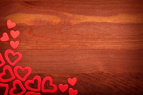 Red hearts on wooden background — Stock Photo, Image