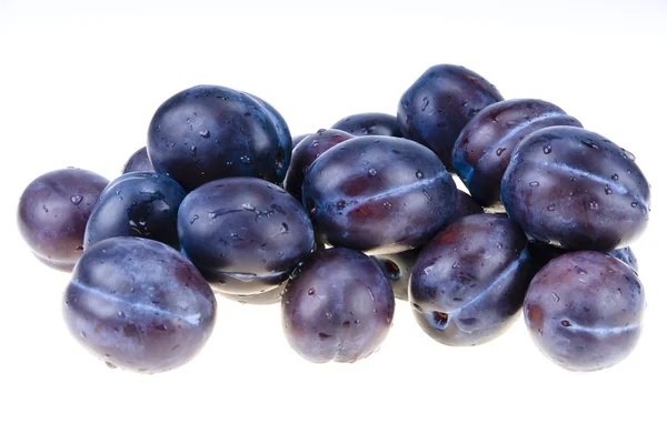 Stack of blue plums isolated — Stock Photo, Image