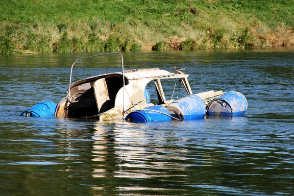 stock image Sinking motor boat in a river