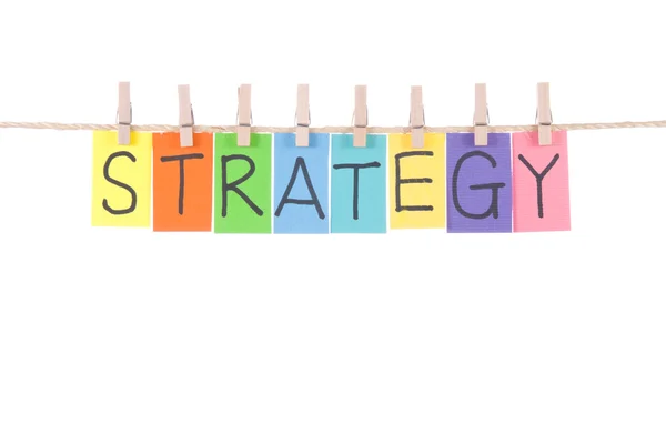 Strategie, woorden hangen door houten peg — Stockfoto