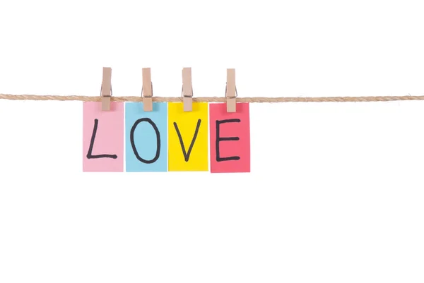 Love, Wooden peg and colorful words — Stock Photo, Image