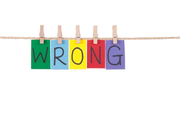 Wrong, Wooden peg and colorful words — Stock Photo, Image