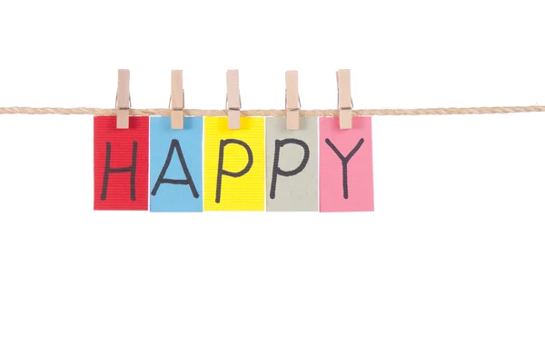 Šťastný, dřevěný kolík a barevné slova — Stock fotografie