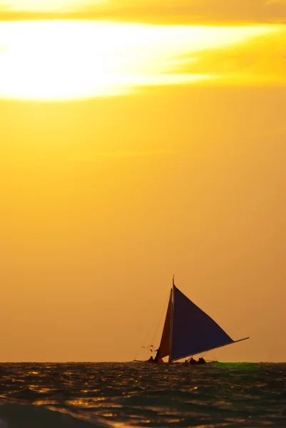 stock image Sailboat on the sea under sunset