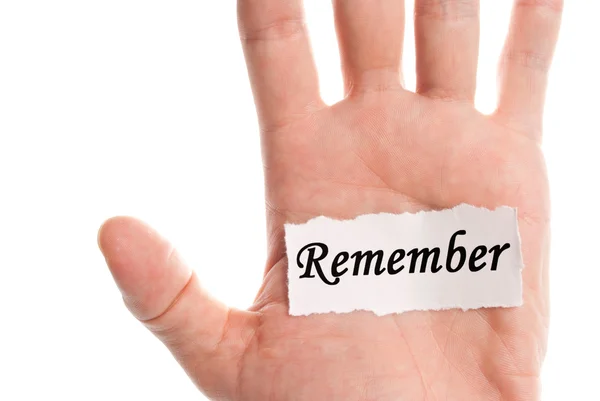 Remeber word type on paper on hand — Stock Photo, Image