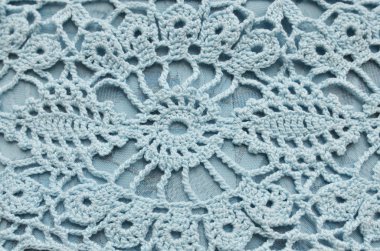 Close-up of blue crocheting pattern clipart