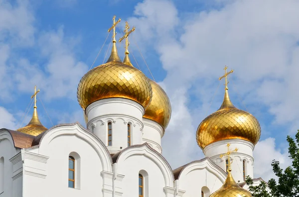 Towers and golden cupolas of church — Stock Photo, Image