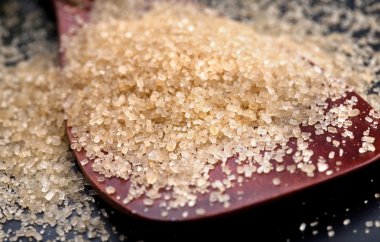 Closeup of brown granulated sugar clipart