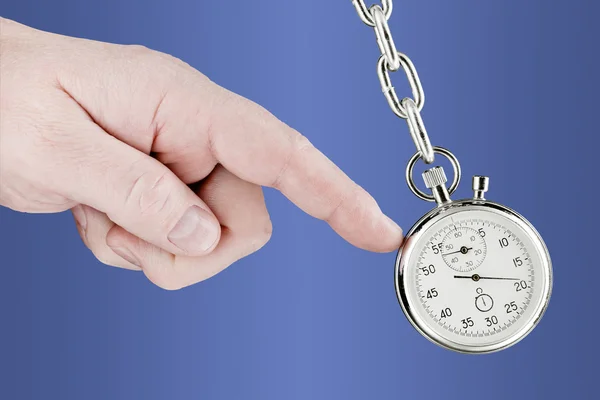 Stopwatch pendulum and hand Stock Image