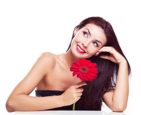 Brunett kvinna med en blomma — Stockfoto