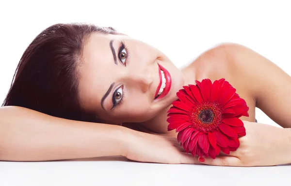 Brunette vrouw met een bloem — Stockfoto