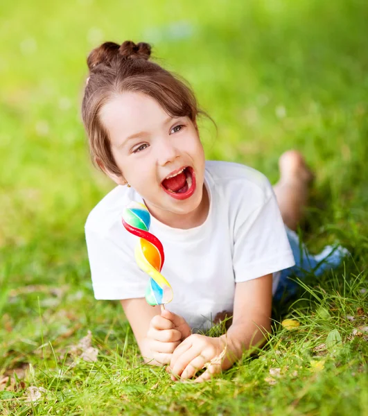 Girl with a lollipop — Stock Photo, Image