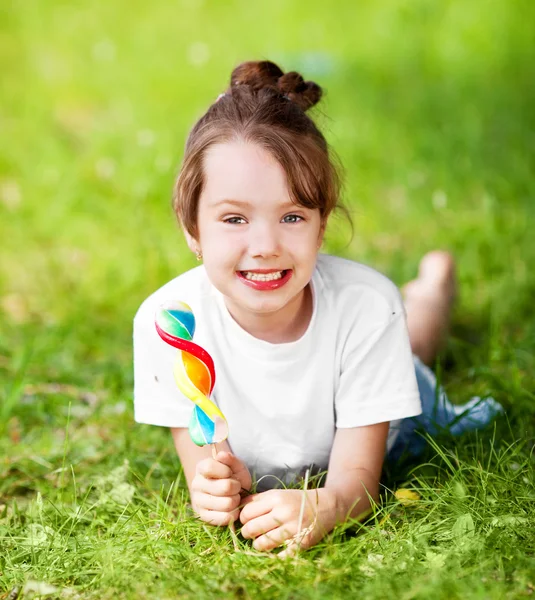 Girl with a lollipop — Stock Photo, Image