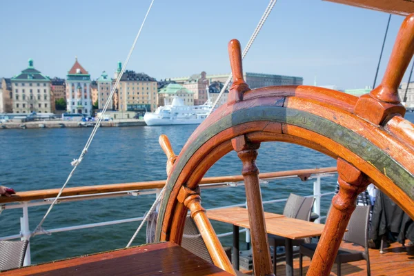 Ship helm and a view on Stockholm, Sweden — Stock Photo, Image